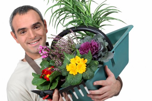 Gardener carrying out maintenance work in a garden
